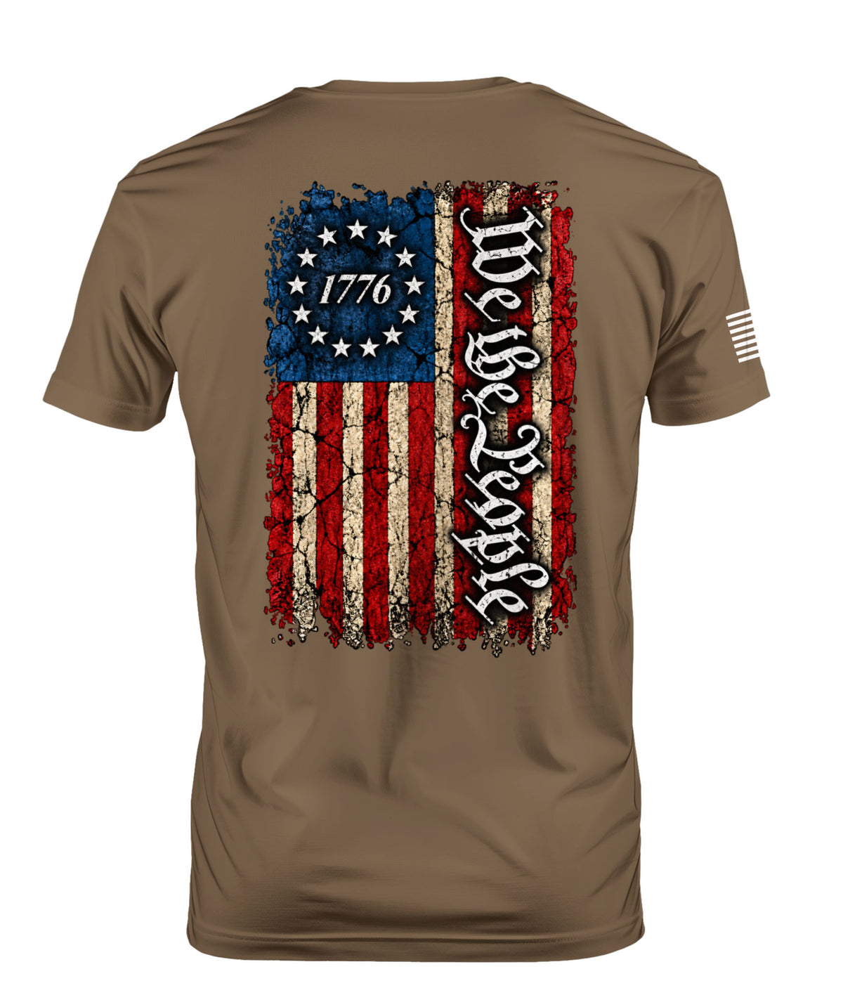 A brown short-sleeve t-shirt shown from the back, featuring a distressed American flag graphic with 'We the People' written vertically in black gothic lettering and '1776' inside the stars.