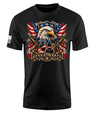 A black short-sleeve t-shirt with a detailed patriotic graphic on the chest featuring an eagle, crossed rifles, American flags, and the year 1776. A small black-and-white American flag is printed on the right sleeve.