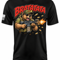 A black short-sleeve t-shirt with a large graphic print of a bear wearing a green cap and holding a rifle, with the text 'BRATATATA' in red above it. A small American flag graphic is visible on the right sleeve.