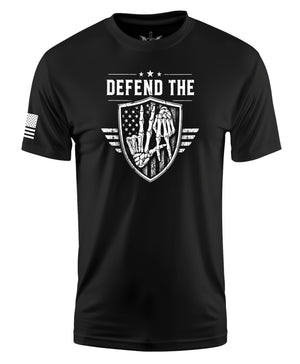 A black short-sleeve crewneck t-shirt featuring a white graphic print on the front with the text 'DEFEND THE' above a shield design with a skeleton and an American flag. A small white American flag graphic is printed on the right sleeve.