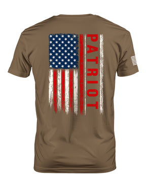 A brown short-sleeve t-shirt with a distressed American flag graphic on the back, featuring red and white stripes and white stars on a blue field, with the word 'PATRIOT' printed vertically in red. A small white flag graphic is visible on the left sleeve.