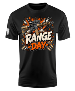 A black short-sleeve t-shirt with a graphic on the front featuring a rifle, bullet casings, and the text 'RANGE DAY' in bold white and orange lettering. A small American flag graphic is visible on the right sleeve.
